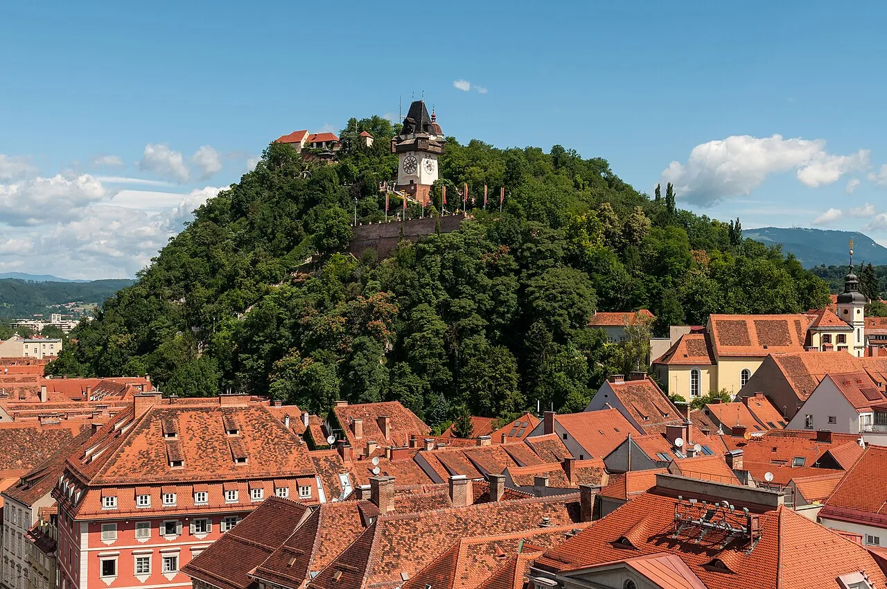 View over the rooftops of Graz towards the Schlossberg
